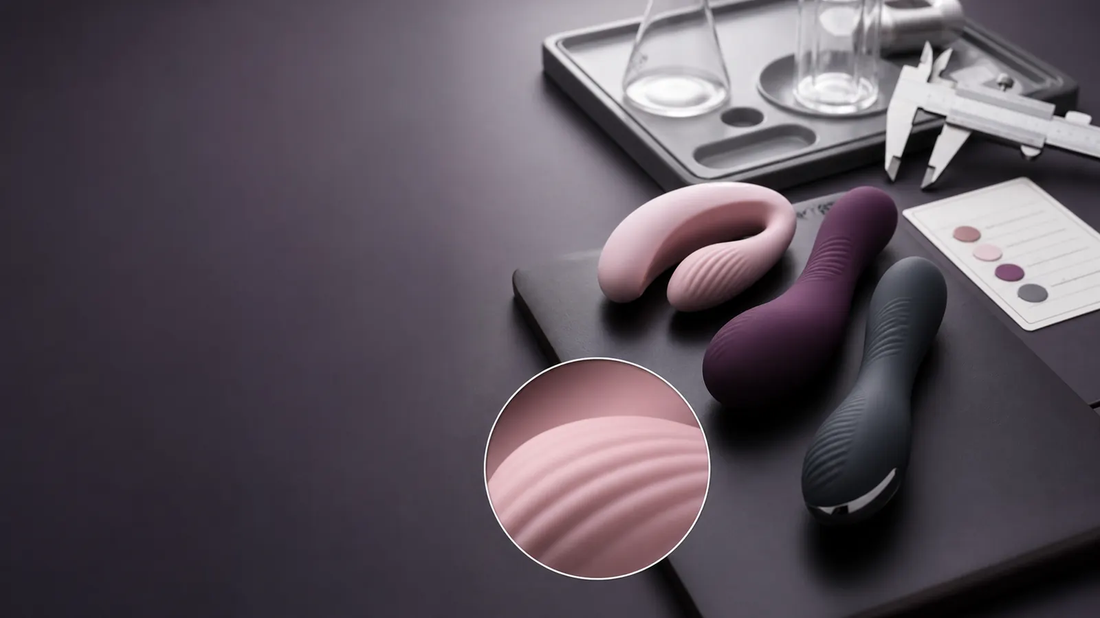Premium silicone wellness products arranged with product inspection tools on a clean studio tray.